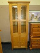 A MODERN LIGHT OAK GLAZED BOOKCASE H-191 W-72 CM