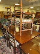 A YOUNGER & SONS OAK EXTENDING TABLE AND SIX CHAIRS