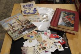 A SMALL QUANTITY OF STAMPS - LOOSE AND IN ALBUMS