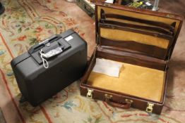 A USA SENTRY SAFE FIREPROOF CASE TOGETHER WITH A MODERN BROWN BRIEFCASE (2)