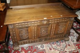A 20TH CENTURY CARVED OAK COFFER W-109 CM