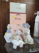 THREE BOXED NAO FIGURINES