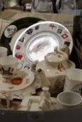 A TRAY OF MILITARY RELATED CERAMICS ETC TO INCLUDE CRESTEDWARE TEAPOTS AND PLATES ETC