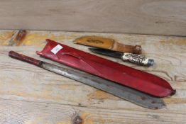 A SOLINGEN KNIFE AND SHEATH PLUS A LEATHER HANDLED MACHETE