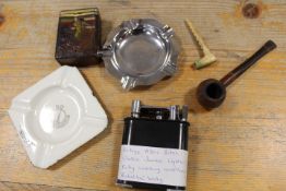 A VINTAGE BAKELITE LIGHTER WITH A SELECTION OF TOBACCIANA ITEMS