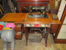 A VINTAGE OAK TREADLE SINGER SEWING MACHINE
