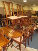 A QUALITY MAHOGANY EXTENDING 'D-END' TWIN PEDESTAL TABLE WITH SIX EARLY 20TH CENTURY CHAIRS
