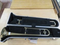 AN OLDS TROMBONE IN RIGID CARRY CASE