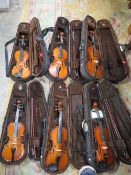 SIX ASSORTED VIOLINS IN BROWN CARRY CASES