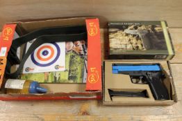 A BOXED AIRSOFT PISTOL , TARGETS ETC AND WEBBING BELT