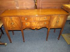 A REPRODUCTION MAHOGANY SHAPED SIDEBOARD - W 160 CM