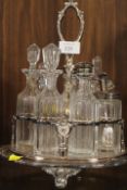 A ANTIQUE SILVER PLATED SEVEN BOTTLE CRUET