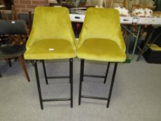 A PAIR OF MODERN MUSTARD UPHOLSTERED KITCHEN STOOLS