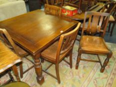 A VINTAGE OAK DRAWLEAF TABLE AND FOUR CHAIRS