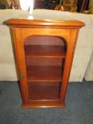 A SMALL MAHOGANY GLAZED SIDE CABINET