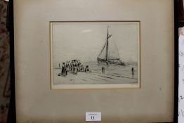 A FRAMED AND GLAZED ENGRAVING OF A DUTCH STYLE HARBOUR SCENE