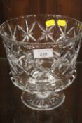 A LARGE CUT GLASS FOOTED BOWL
