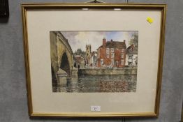 A GILT FRAMED AND GLAZED WATERCOLOUR OF A RIVERSIDE TOWN SCENE ENTITLED 'VIEW ACROSS THE SEVERN -