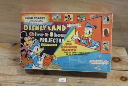 A BOXED CHAD VALLEY DISNEYLAND GIVE A SHOW PROJECTOR WITH SLIDES - NOT TESTED