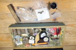 A SMALL GLAZED WOODEN CASE OF COLLECTABLES