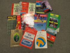 A FOLDER OF FA CUP FINAL PROGRAMMES, ENGLAND PROGRAMMES ETC TO INCLUDE LEEDS UNITED v LIVERPOOL