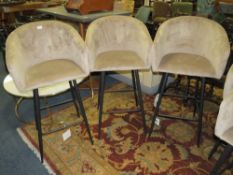 A SET OF THREE TAUPE UPHOLSTERED KITCHEN STOOLS