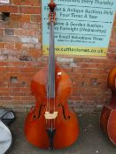 A DOUBLE BASS IN CARRY CASE WITH TWO BOWS