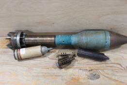 AN INERT 1950s RUSSIAN TRAINING BAZOOKA SHELL TOGETHER WITH AN ASSORTMENT OF MORTAR PARTS
