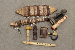 INDONESIAN DAYAK TRIBAL ART SHIELD, KNIFE SHEATH, A DAYAK MANDAU SWORD HILT, BLOW PIPE QUIVER WITH