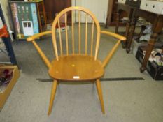 A BLONDE ERCOL HOOPBACK ARMCHAIR