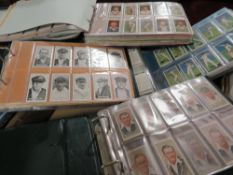 FOUR ALBUMS OF ASSORTED MAINLY SPORTING THEMED CIGARETTE / TEA CARDS