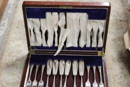 A SMALL WOODEN CASED CANTEEN OF FISH KNIVES AND FORKS
