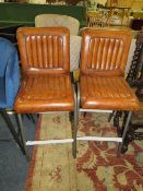 A PAIR OF MODERN TAN LEATHER KITCHEN STOOLS