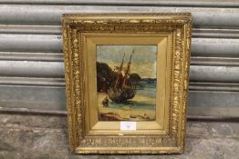 A SMALL GILT FRAMED OIL ON CANVAS OF A BEACHED SAIL SHIP WITH FRAMERS LABEL FROM DUNDEE VERSO