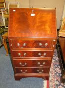 A SMALL MAHOGANY REPRODUCTION BUREAU