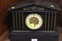 A BLACK SLATE MAUSOLEUM CLOCK
