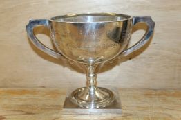 A HALLMARKED SILVER TWIN HANDLED PRESENTATION TROPHY CUP BY A J ZIMMERMAN - BIRMINGHAM 1921 APPROX