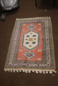 A VINTAGE WOOLEN RUG