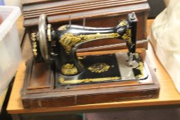 A CASED SINGER SEWING MACHINE