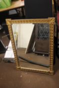 A GILT DECORATIVE MIRROR 87 X 61 CM