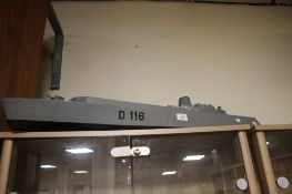 A VINTAGE MODEL OF A BATTLE SHIP