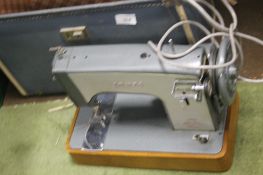 A CASED JONES SEWING MACHINE