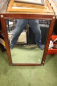 A FRAMED MIRROR 81 X 55 CM