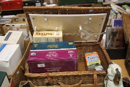 A PICNIC BASKET AND A SMALL SELECTION OF GAMES ETC