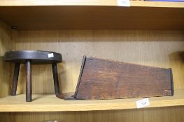 AN ANTIQUE OAK CANDLE BOX AND A MILKING STOOL