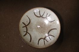 A LARGE SIGNED POTTERY BOWL