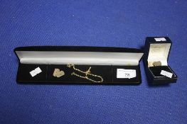 A GOLD T BAR CHAIN AND A PAIR OF CUFFLINKS