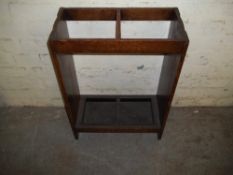 AN ANTIQUE OAK STICK STAND
