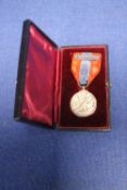 A CASED MEDAL
