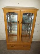 A MODERN MIRRORED DISPLAY CABINET BY WOODBERRY BROS